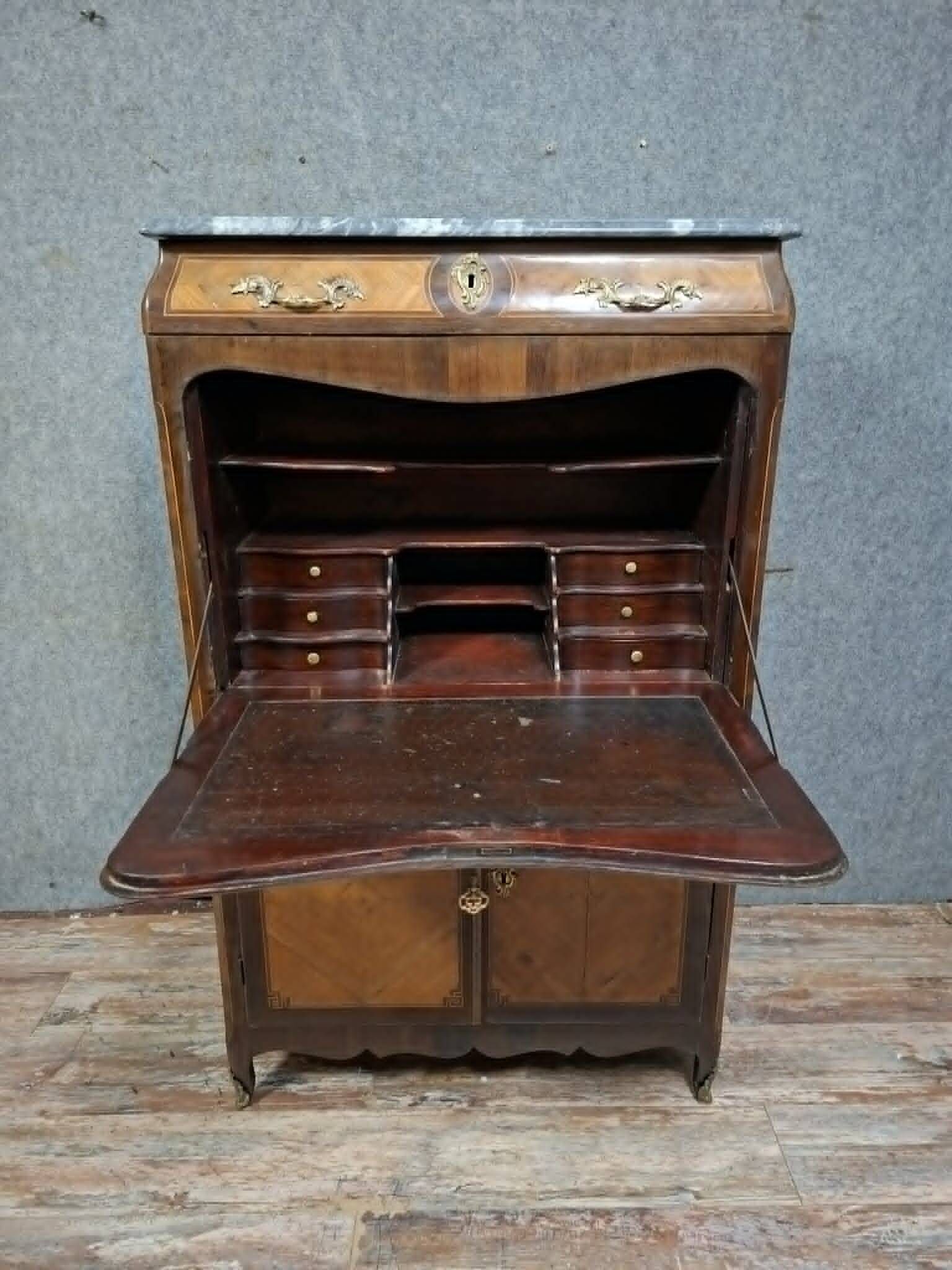 Louis XV period secretary in marquetry and veneer, 18th century.