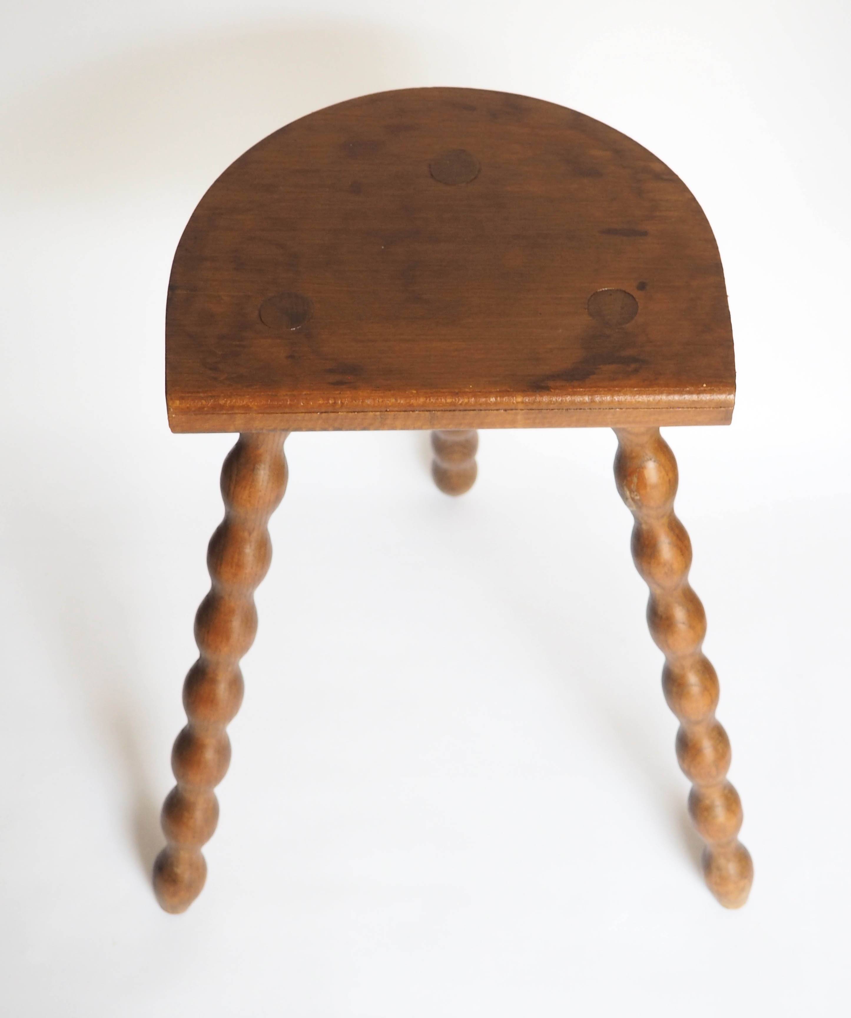 High tripod stool in turned wood