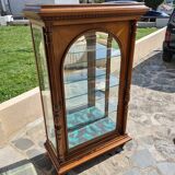 Showcase bookcase in molded and carved walnut