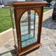 Showcase bookcase in molded and carved walnut