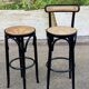 High curved black caned wooden bistro bar stool