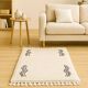 Tapis berbère écru à motifs ondulés noirs