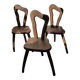 3 brutalist wooden tripod chairs