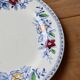 Vintage Gien earthenware flat plate with floral pattern on the border