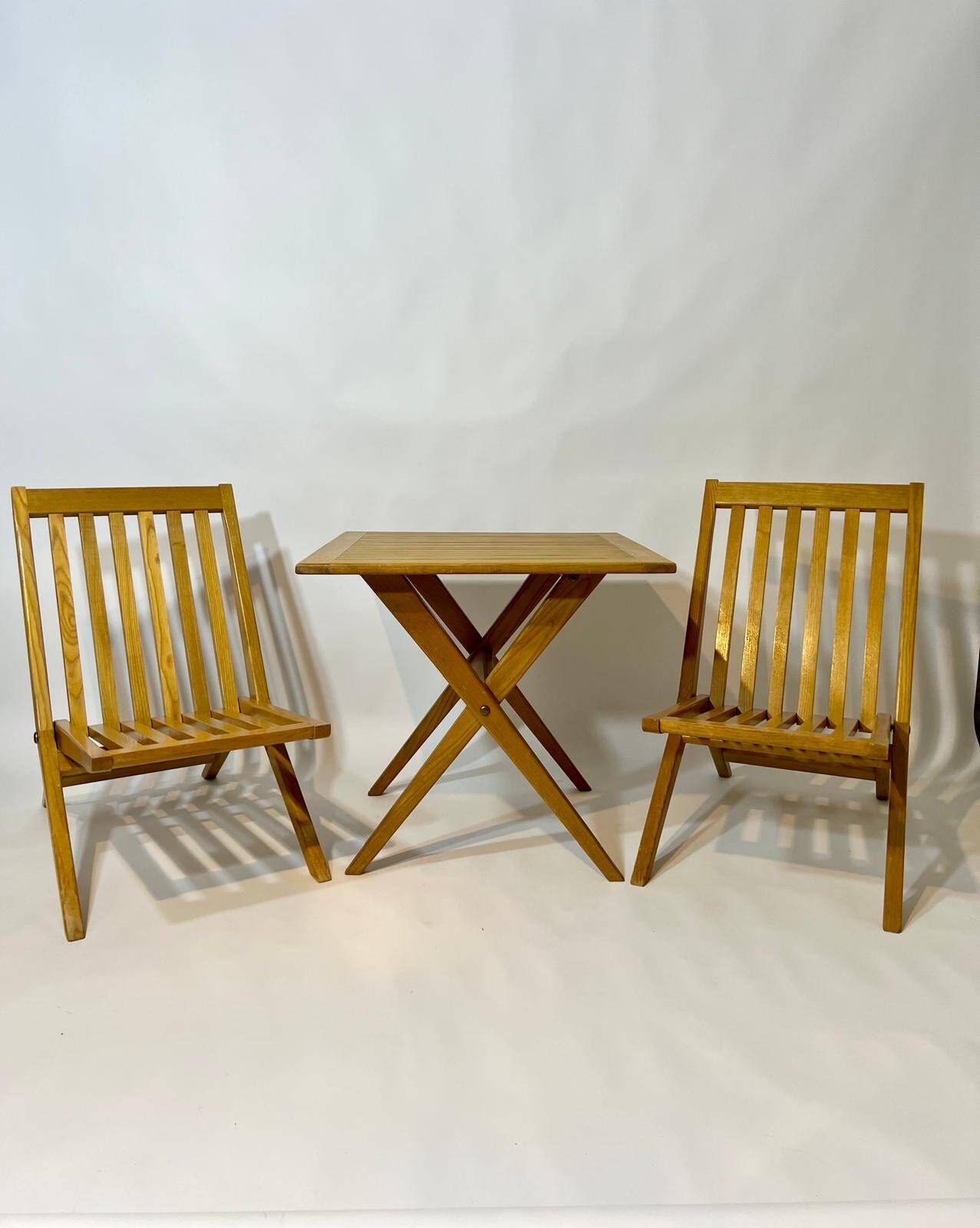 Vintage design solid wood scissor chairs and table from the 1970s