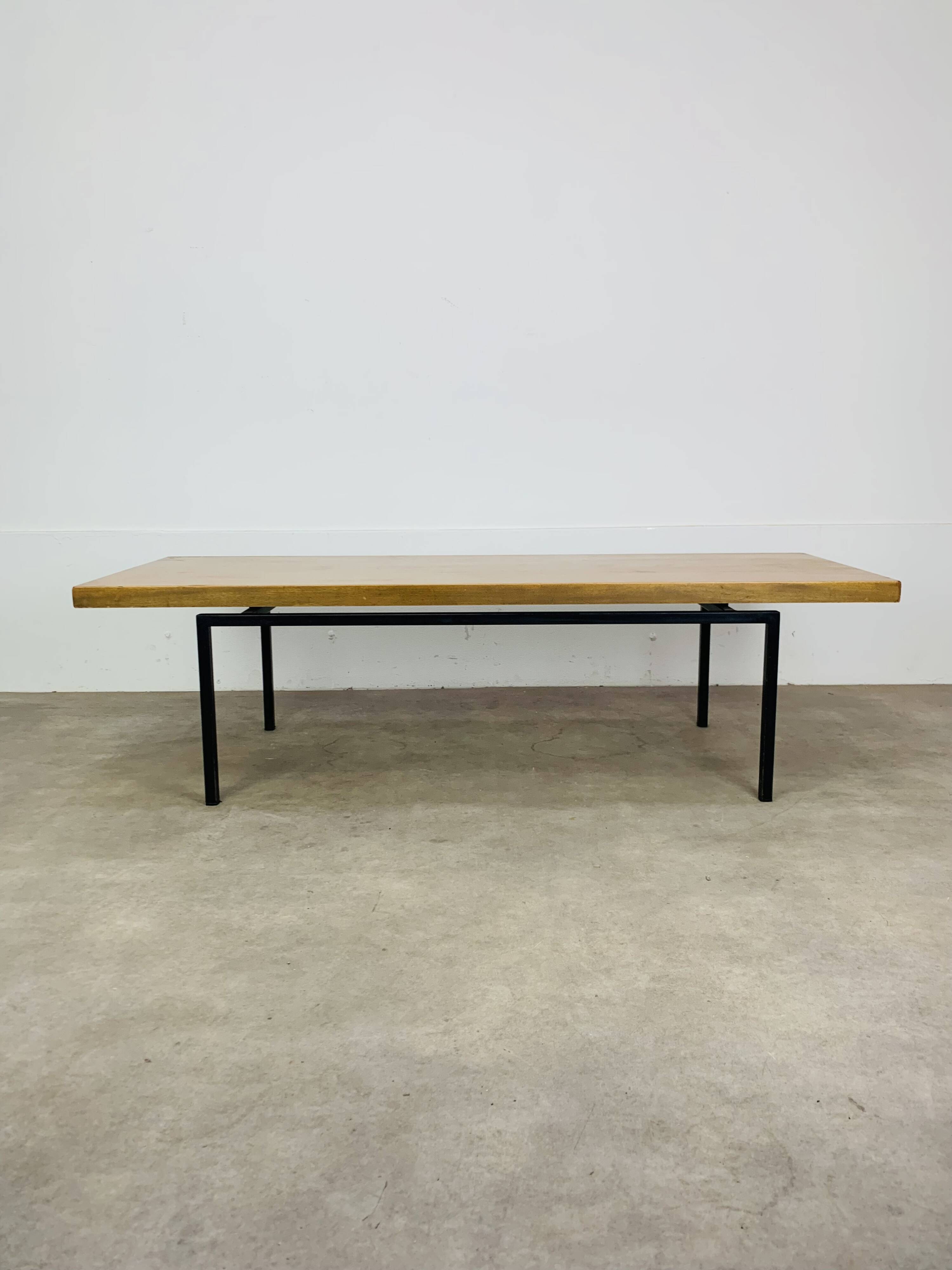 1950s modernist coffee table, wood and black metal.