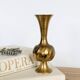 Solid brass Midcentury vase in trumpet shape with twisted details.