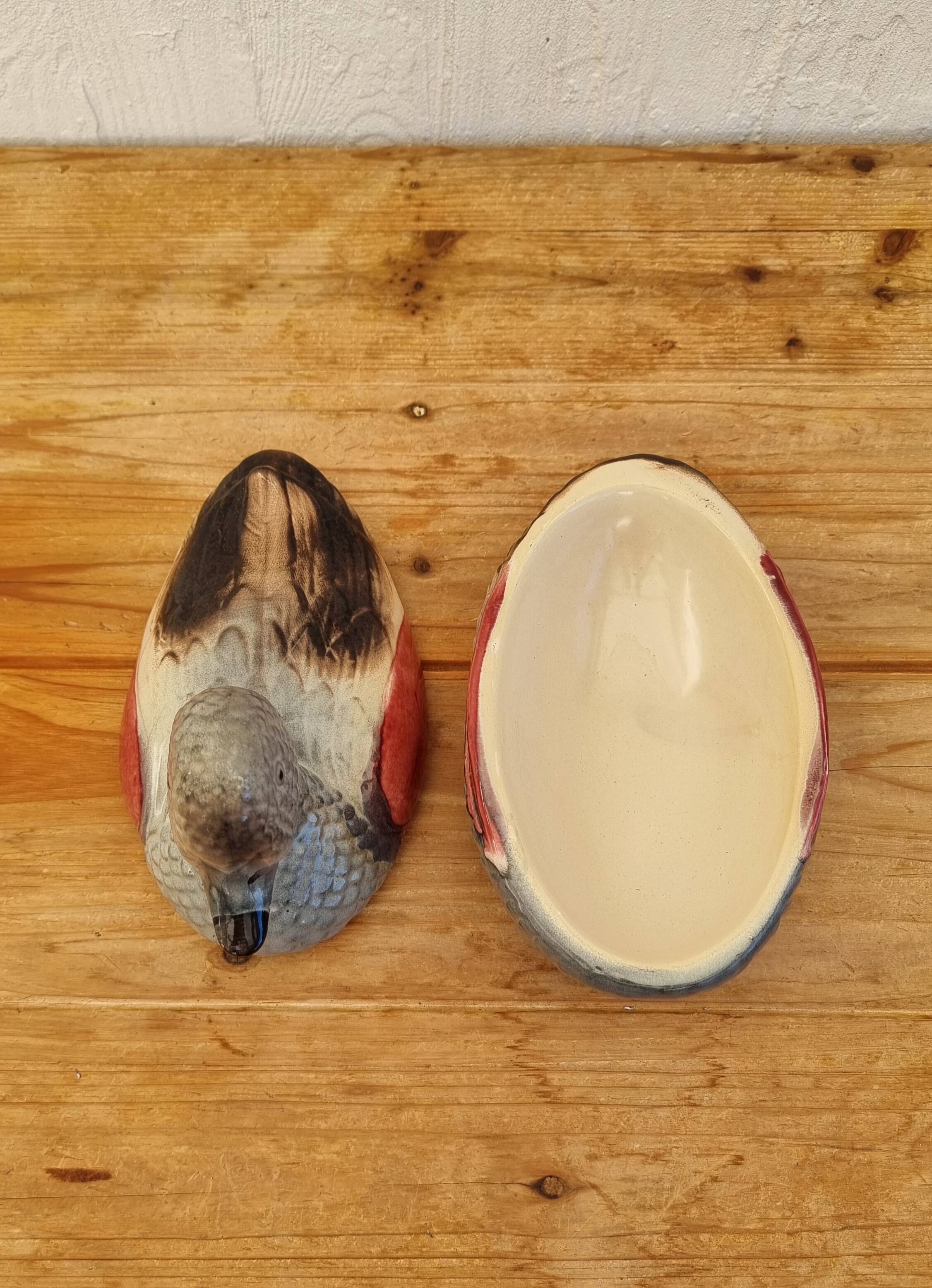 Antique earthenware terrine in the shape of a duck.