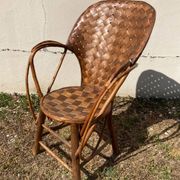 Vintage 1970s armchair in curved woven chestnut + seat cushion