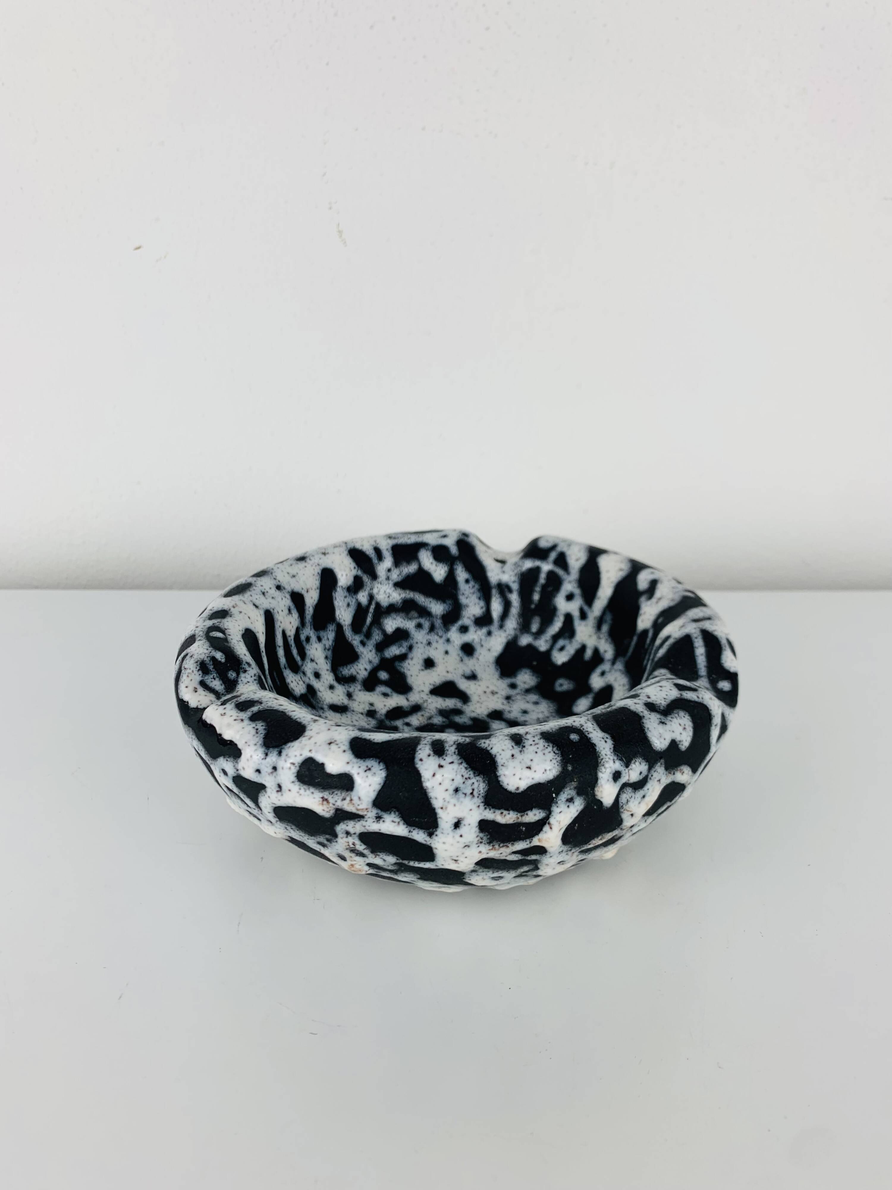 Ashtray and pocket tray by Marius Giuge, fat lava ceramic.