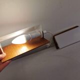 A pair of teak wood wall lamps with plastic shade.