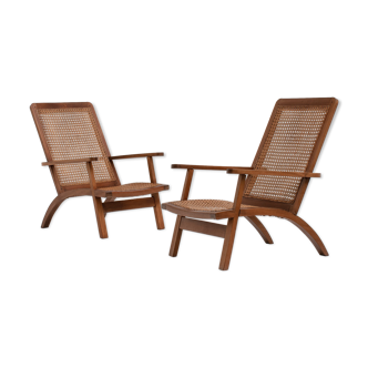 paire de fauteuils français en acajou et en canne années 1950