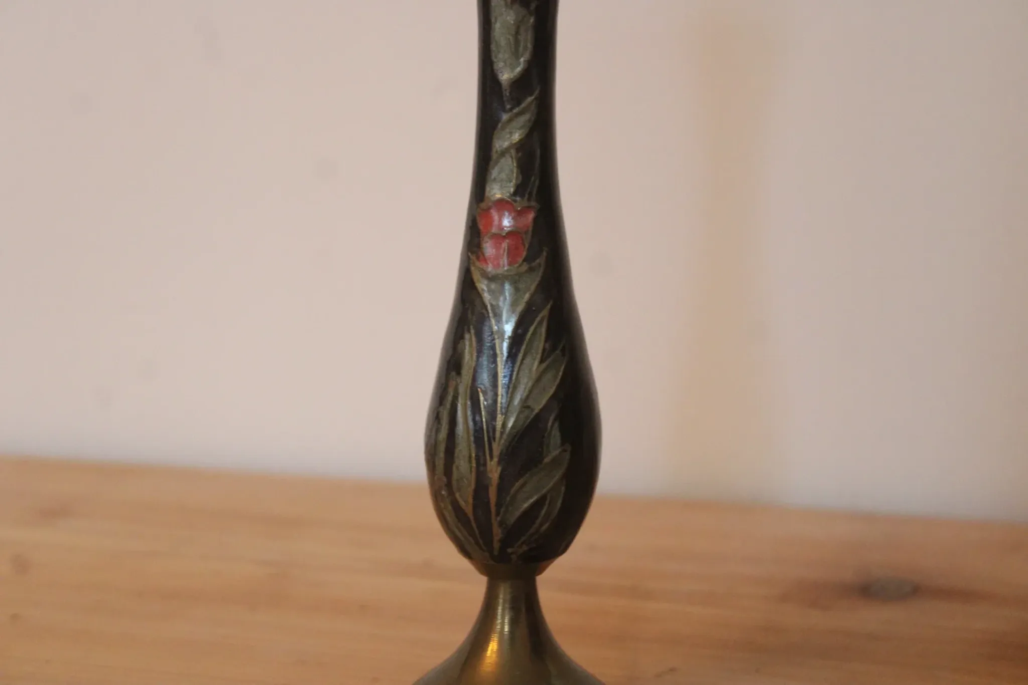 Vintage brass soliflore vase with black, red, and green floral decoration – H 18 cm