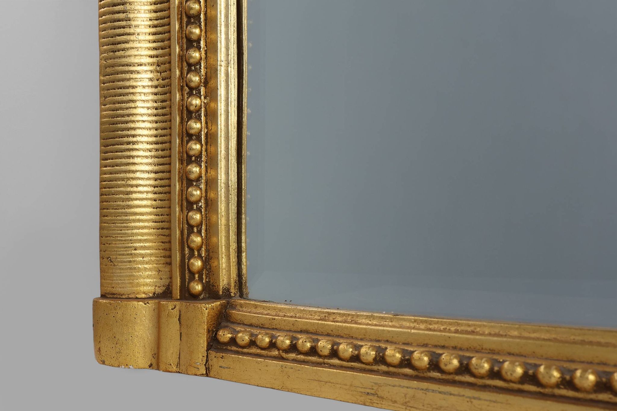 Baroque mantel mirror in carved wood and gilded plaster, France circa 1850.