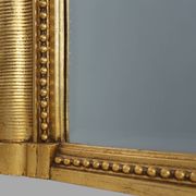 Baroque mantel mirror in carved wood and gilded plaster, France circa 1850.