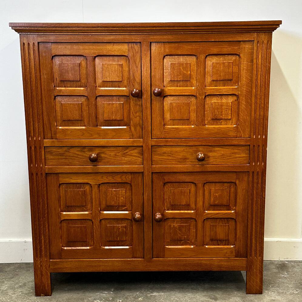 Artisan brutalist oak cabinet with turned knobs, France, 1970s