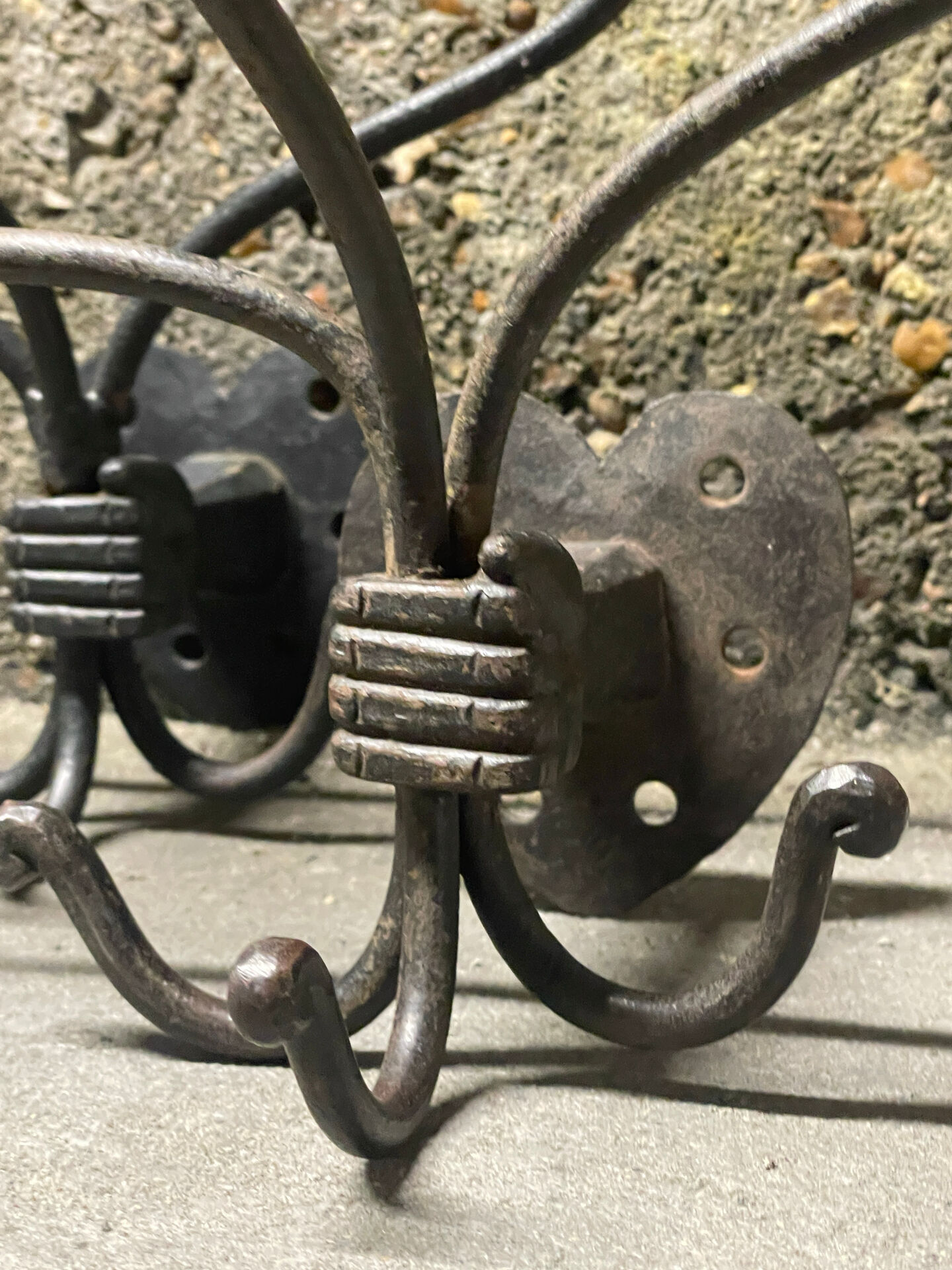 Brutalist pair of wall-mounted coat hooks.
