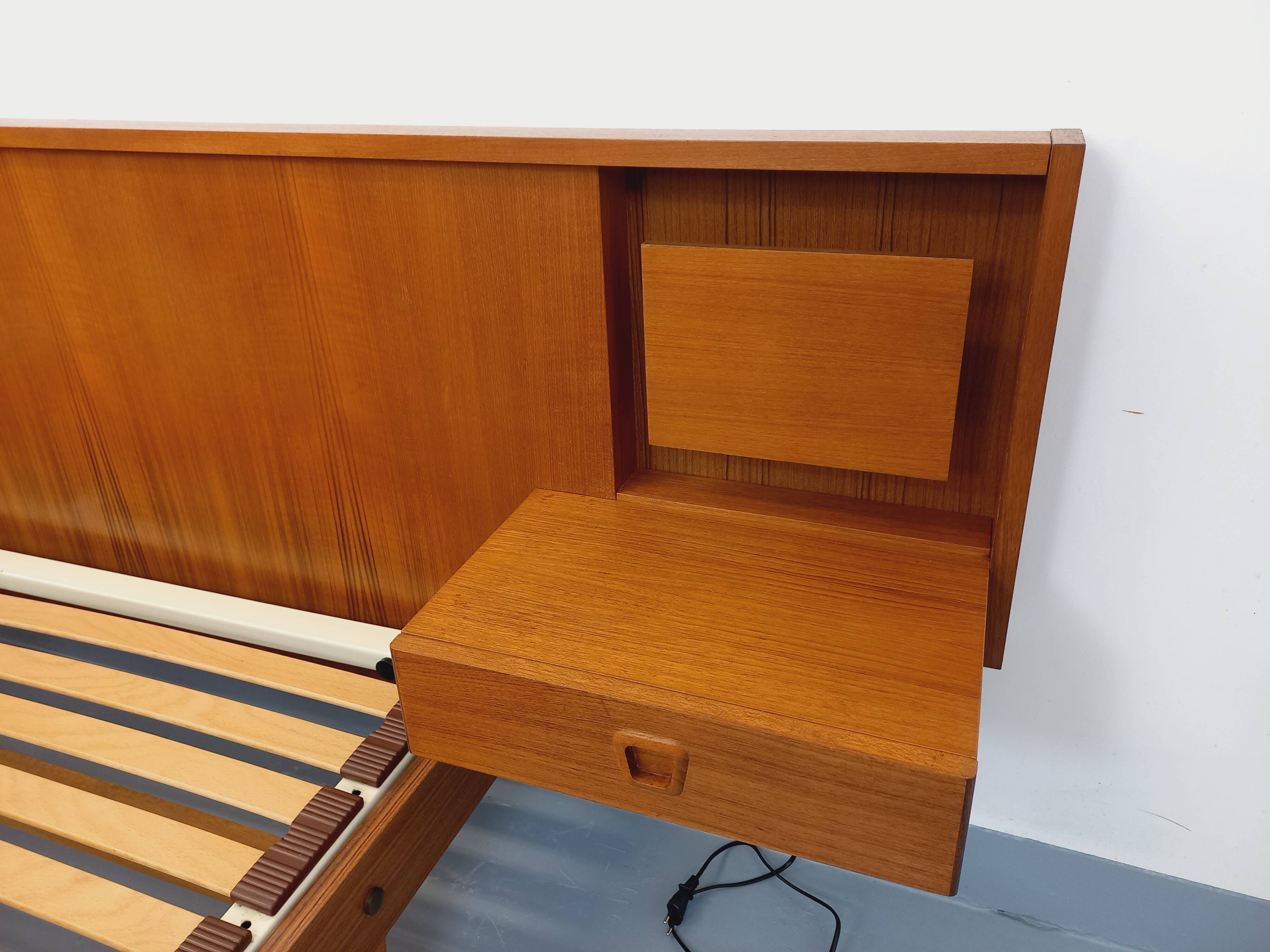 Double bed in vintage Scandinavian style from the 1960s with bedside tables in teak.