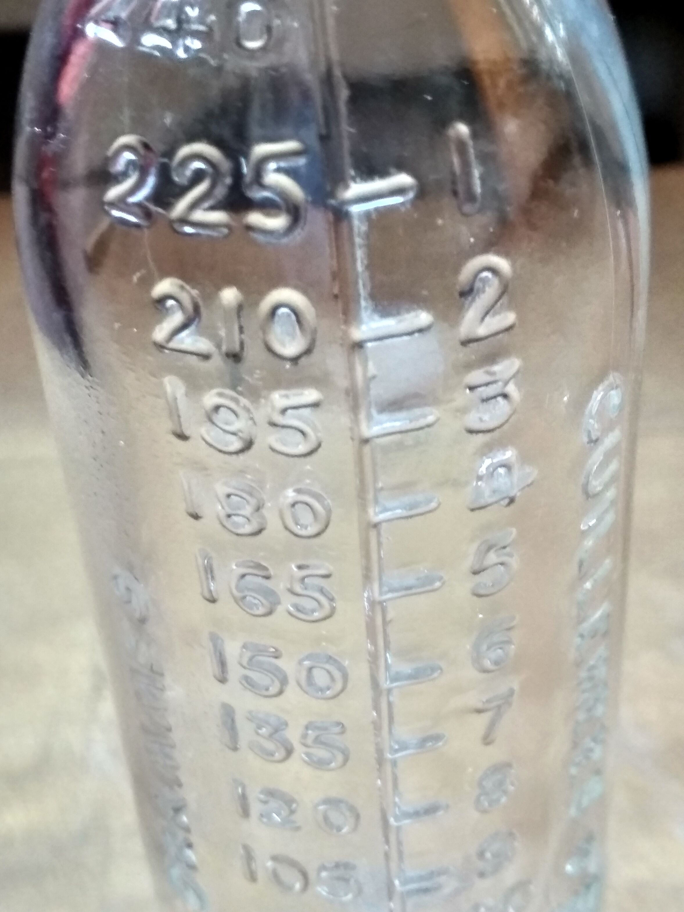 2 old graduated pharmacy bottles
