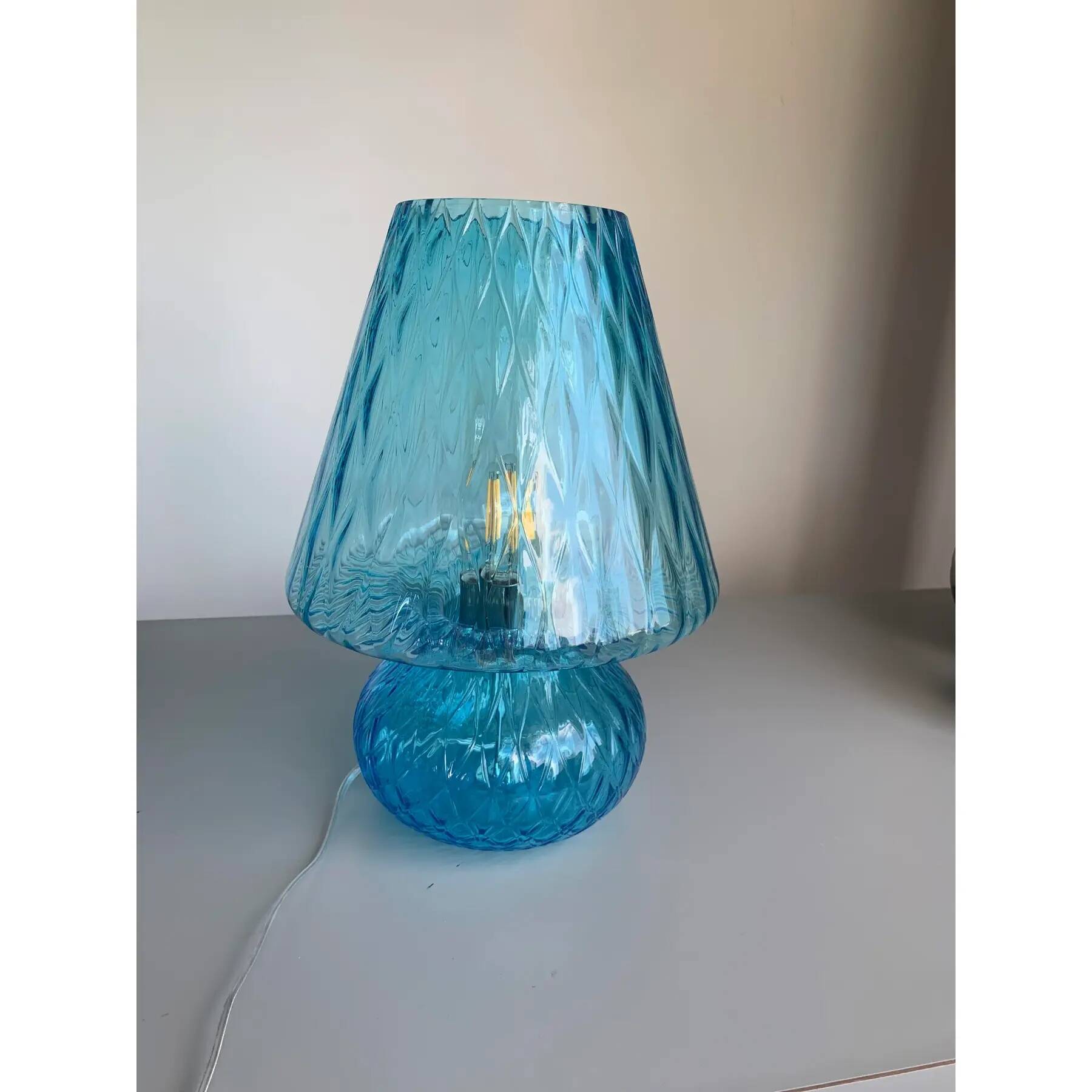 Light blue Murano-style glass with a balloton lamp.
