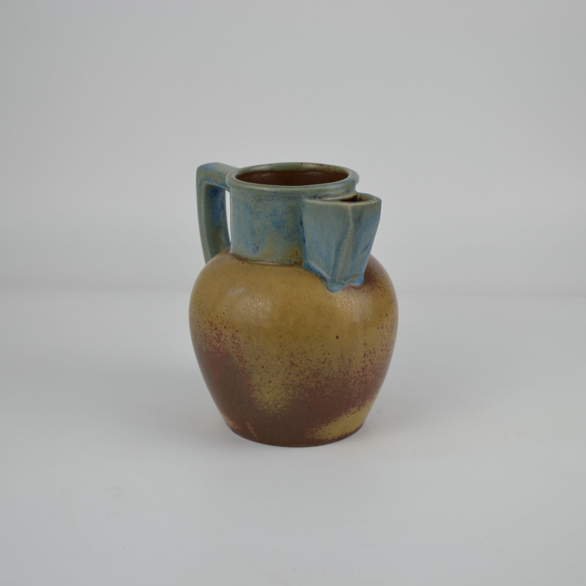 Two-tone stoneware pitcher by Louis Lourioux