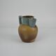 Two-tone stoneware pitcher by Louis Lourioux
