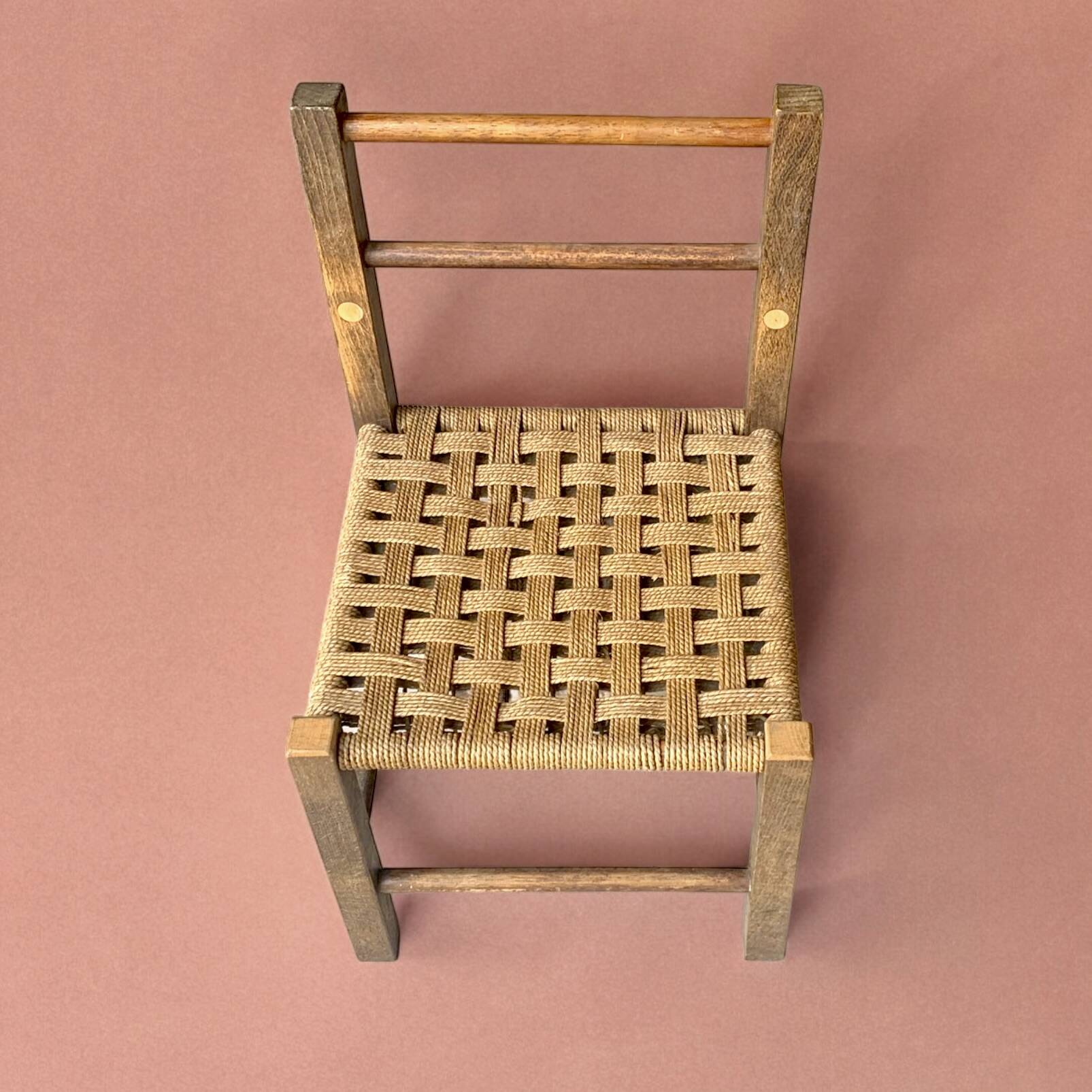 Vintage children's chair made of rope and wood