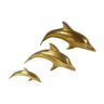 Three brass dolphins