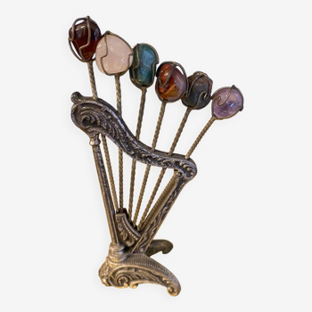 Vintage display with tapas biorneaux sticks in the shape of a harp with beads