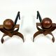 Paire de chenets Art Déco pour cheminée, en cuivre et fer, vers 1920