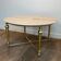 Brass coffee table with a white marble top.