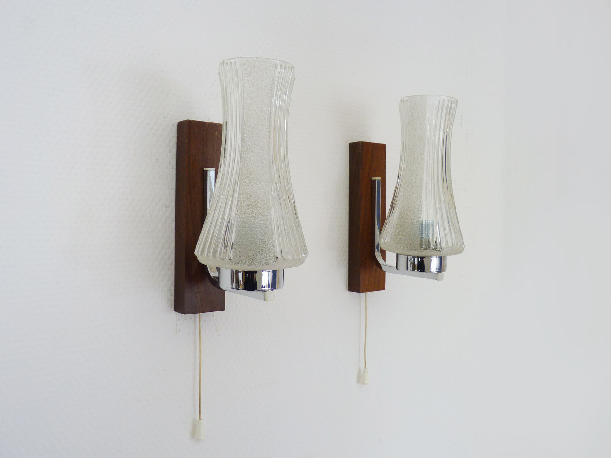 Pair of Scandinavian vintage wall sconces with pull shot, wood and chrome metal. Year 60