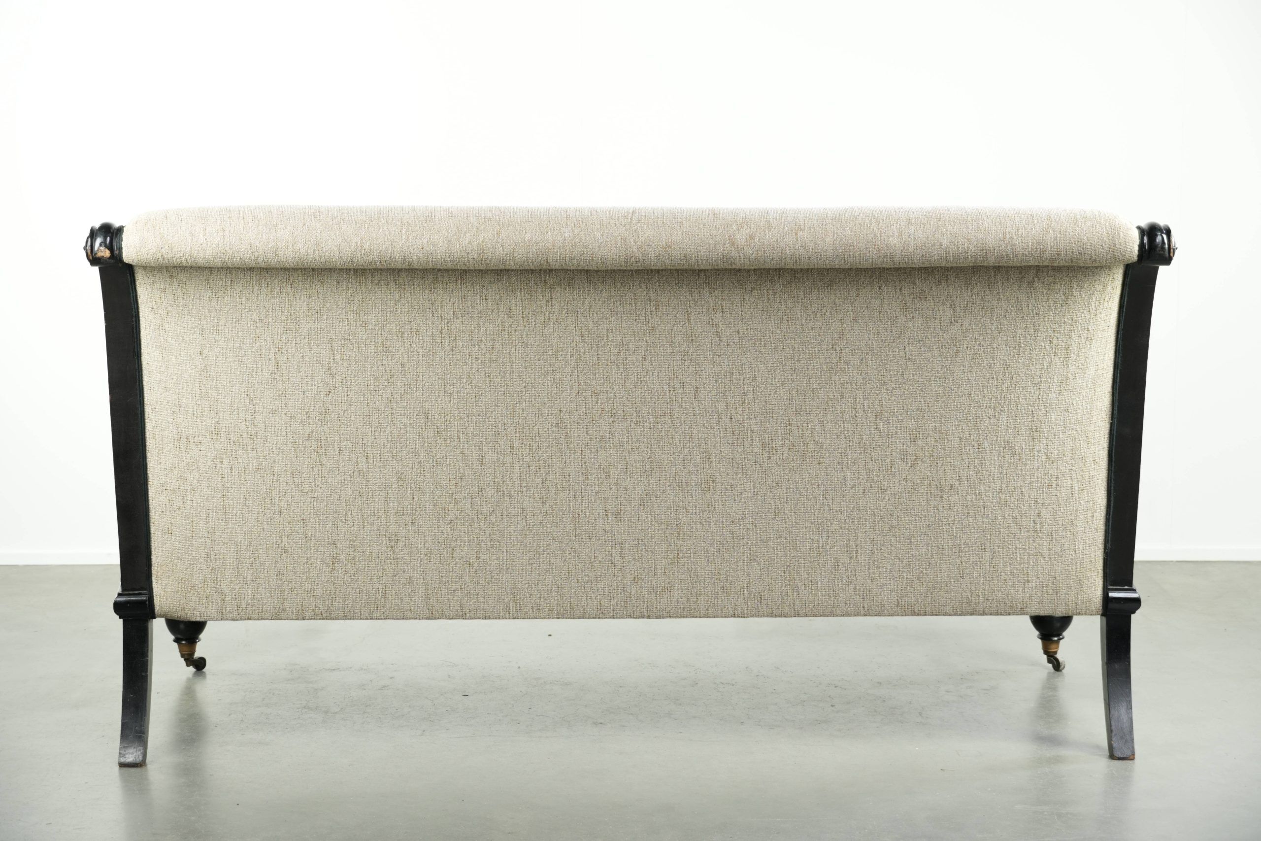 French sofa from the 19th century in Empire style with detailed armrests