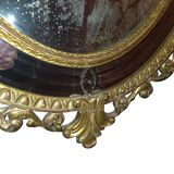 Miroir ovale en bois doré