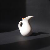 White and orange pitcher with organic curves