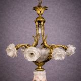 Rare and important gilded bronze chandelier with shells and roses.