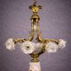 Rare and important gilded bronze chandelier with shells and roses.