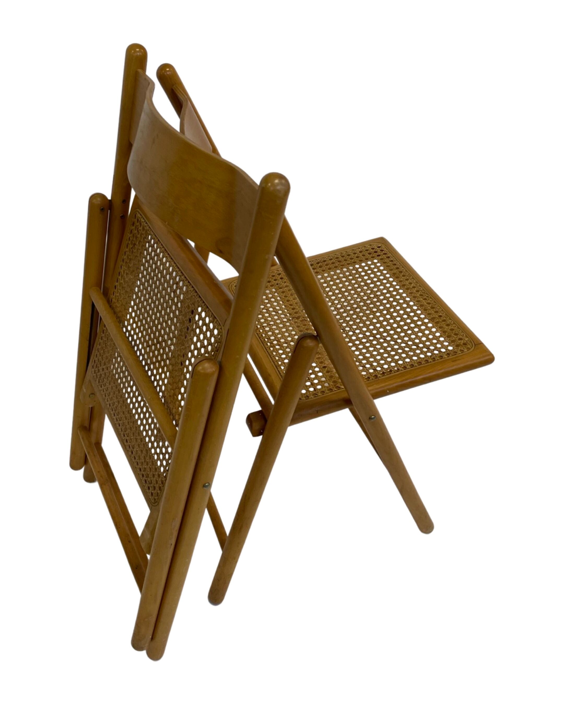 Set of four vintage folding chairs with webbing and wood 1970s