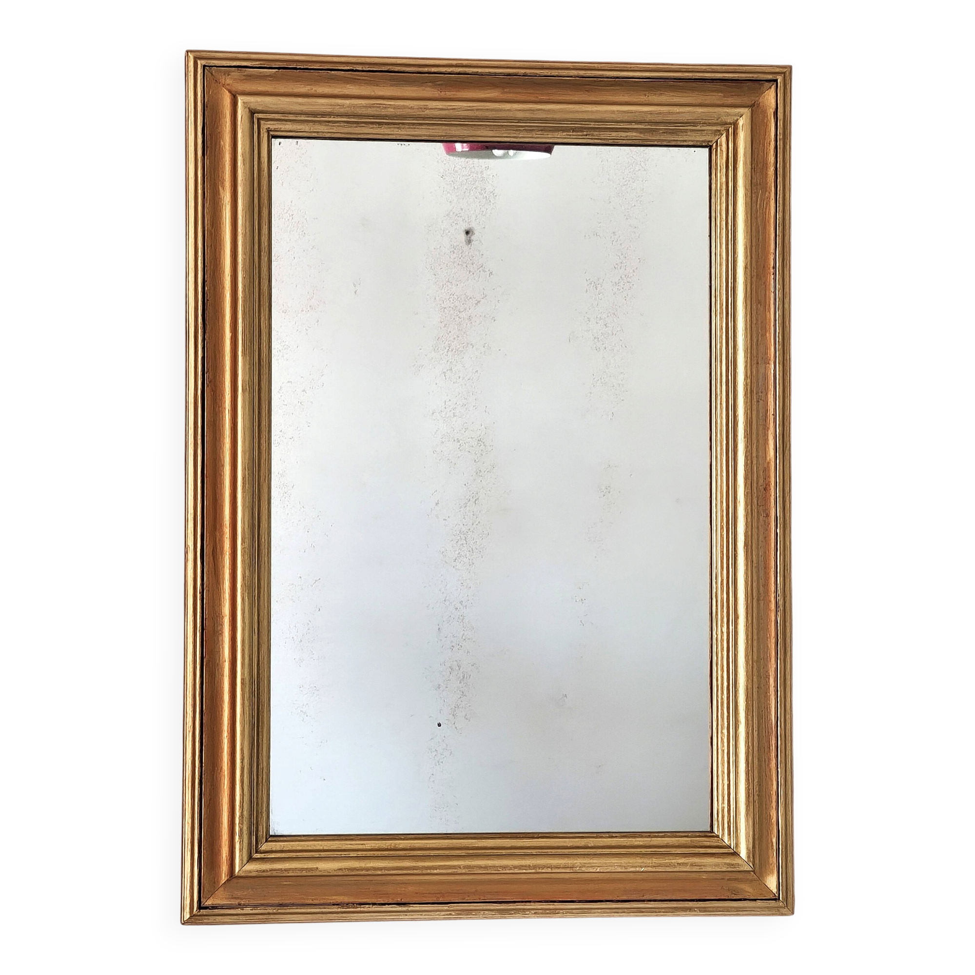 Antique mirror in gilded and copper wood