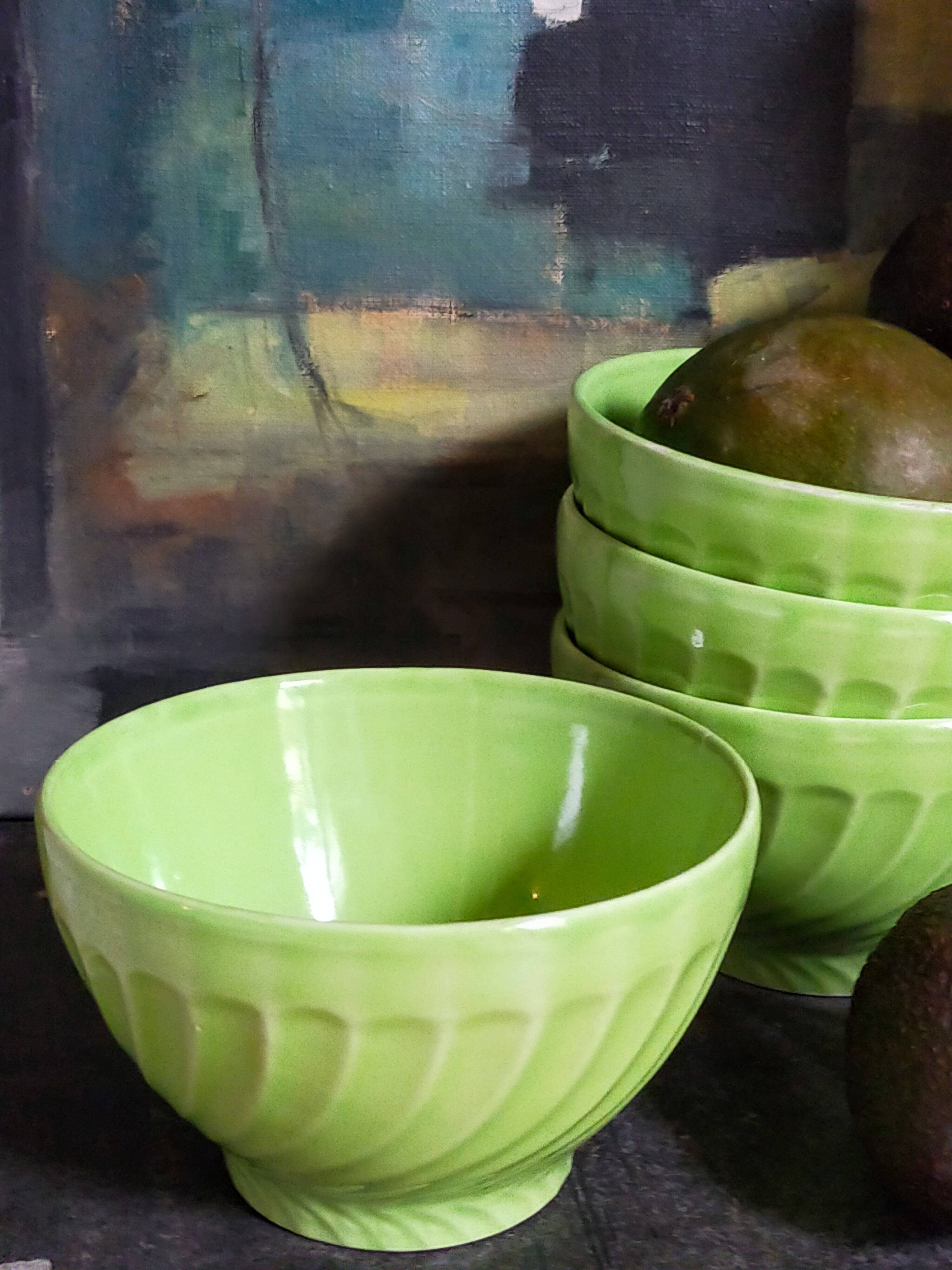 Four vintage spring green earthenware bowls
