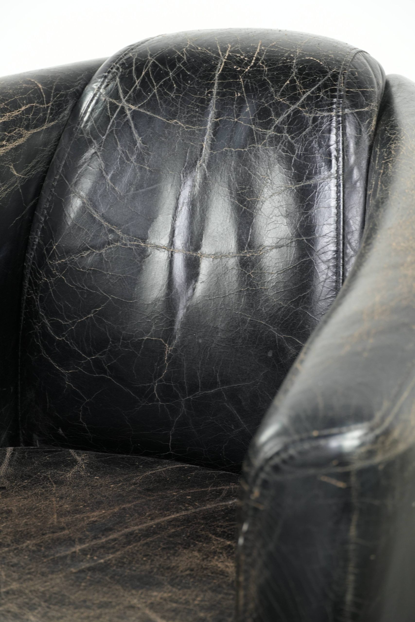 Black vintage cowhide aviator design armchair with characterful appearance
