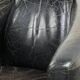 Black vintage cowhide aviator design armchair with characterful appearance