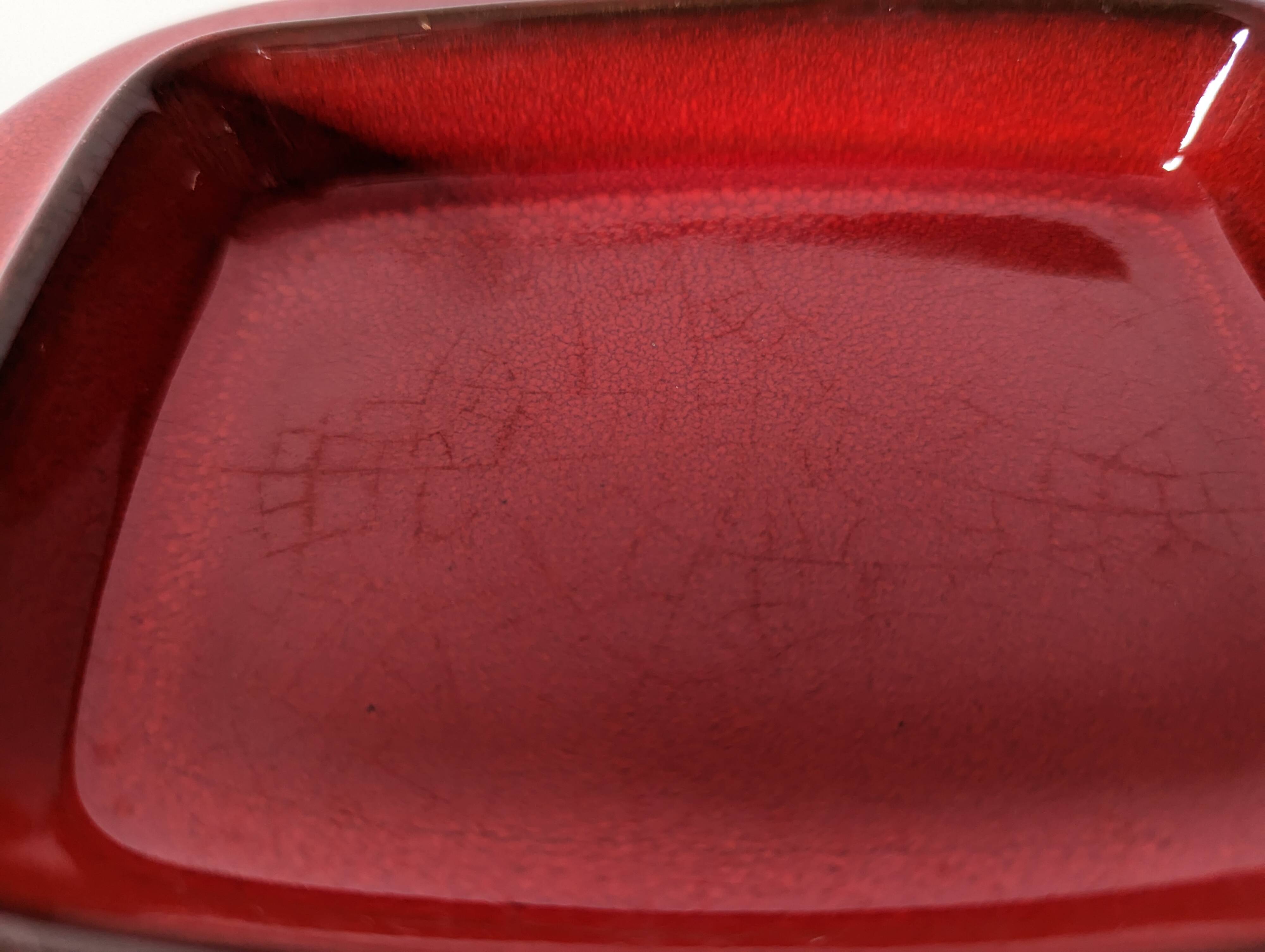 red glazed stoneware butter dish
