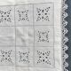 Embroidered table center, surrounded by lace from puy