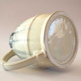 Turquoise and ecru decorative pitcher