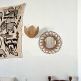 Miroir vintage en rotin formant une fleur