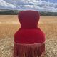 Vintage burgundy velvet armchair with fringes – theatrical and elegant