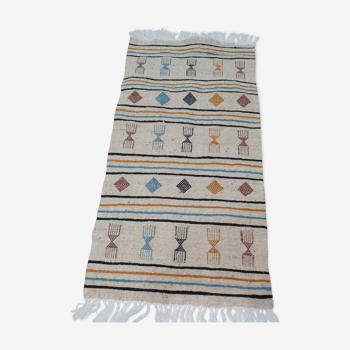 Tapis beige à motifs berbères multicolores