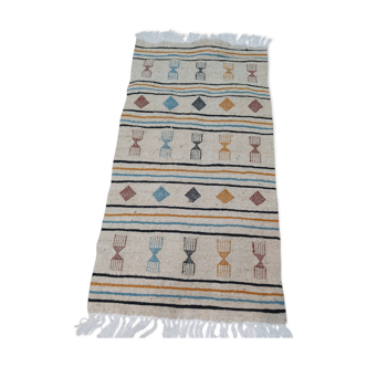 Tapis beige à motifs berbères multicolores