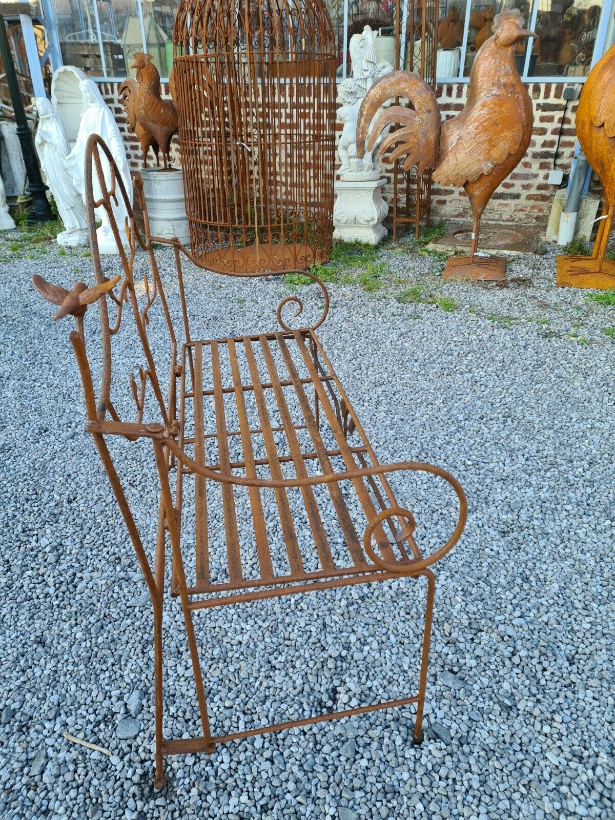 Wrought iron garden bench with birds